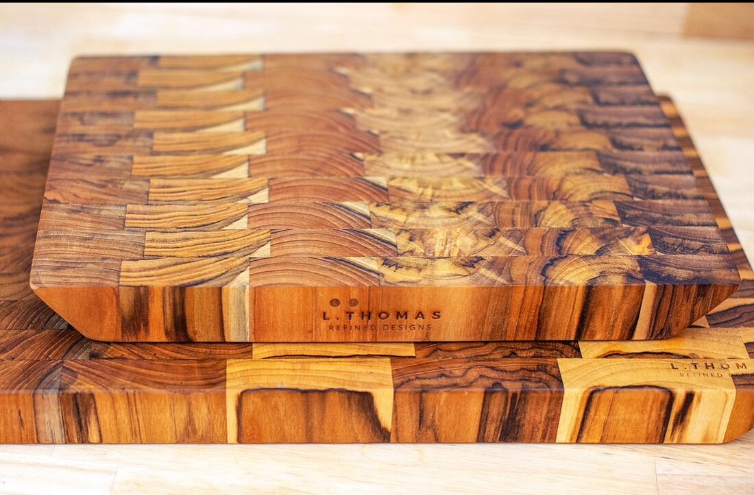 Close view of two signature teak end-grain cutting boards