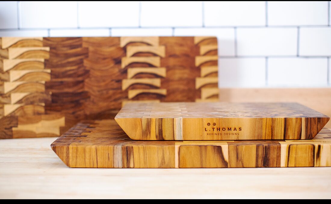 Three handcrafted teak end-grain cutting boards, stamped L. Thomas Refined Designs