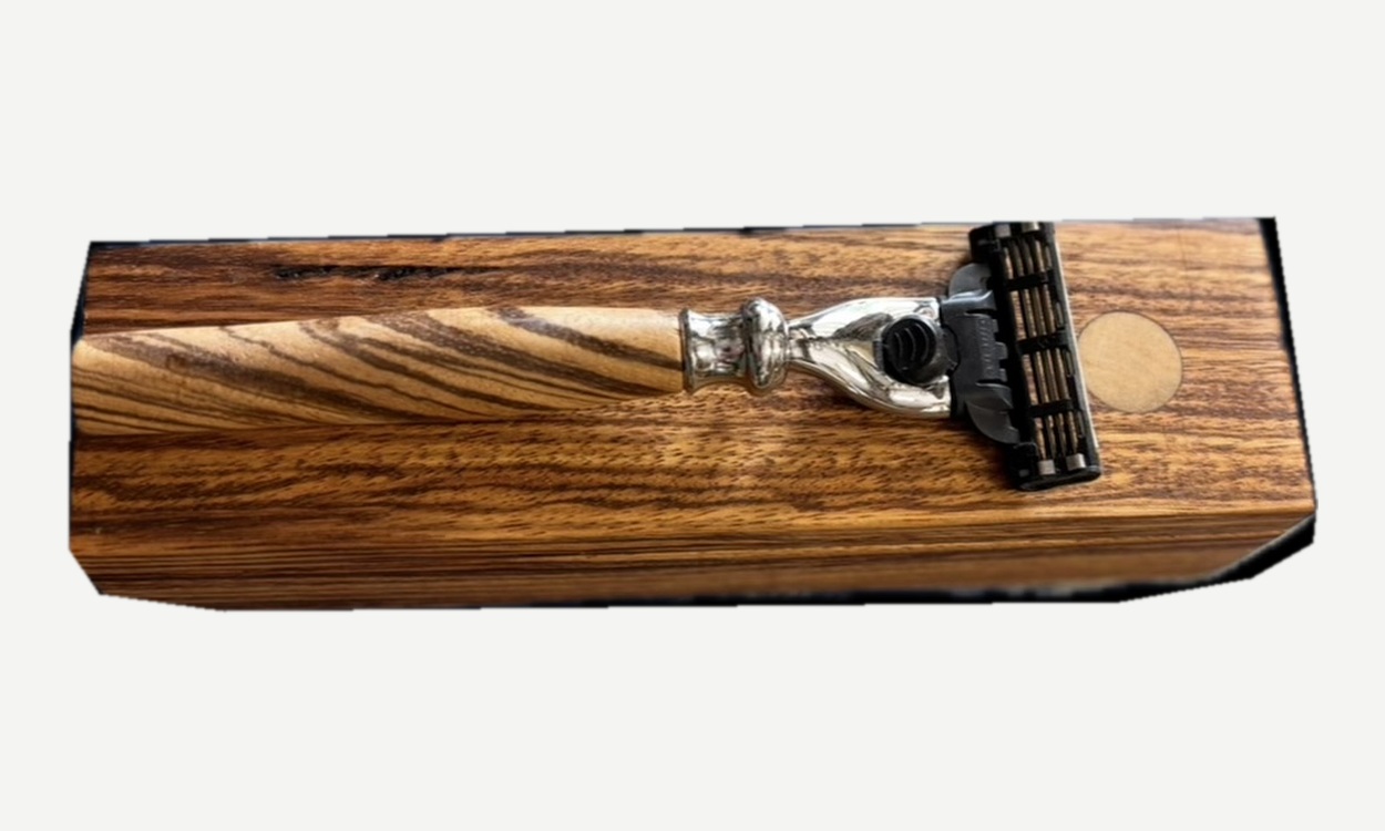 Razor resting on the closed wooden box